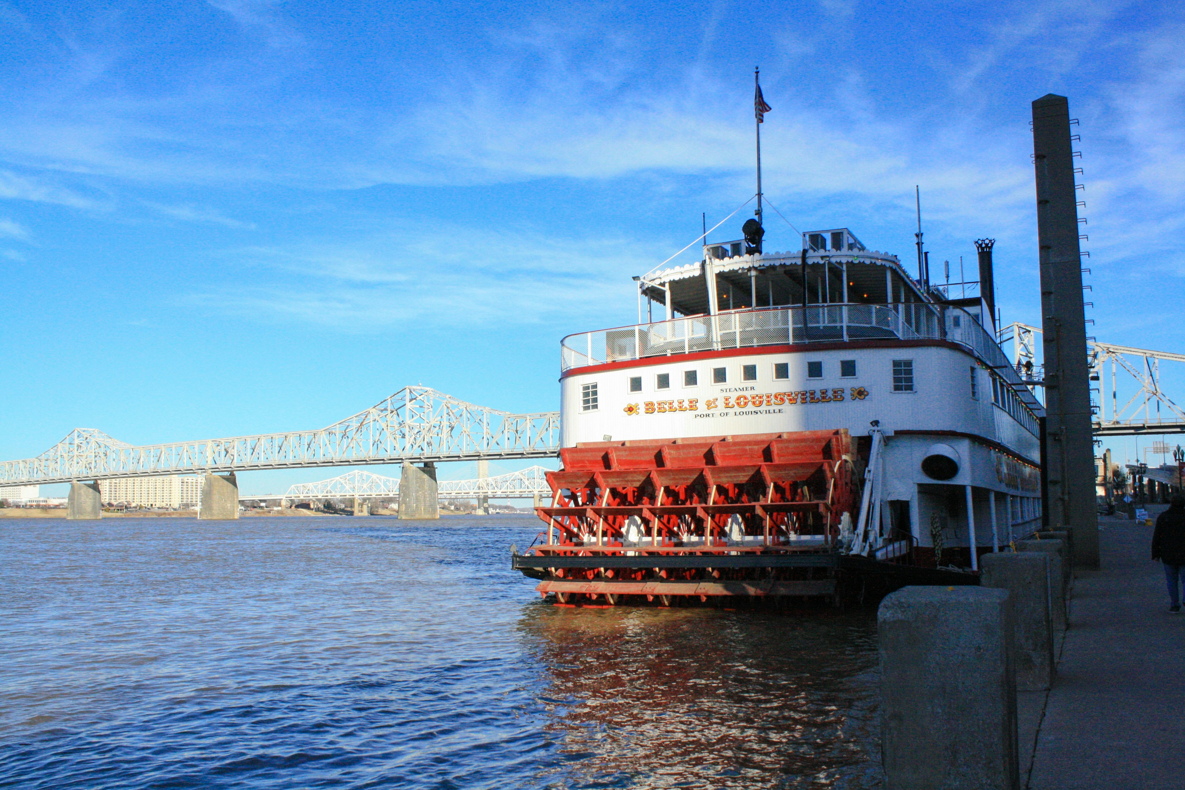belle of louisville in front of bridge